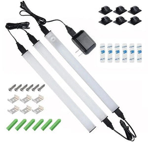 LED cabinet lighting kit with three white tube lights, power adapter, mounting brackets, foam tape strips, screws, and green