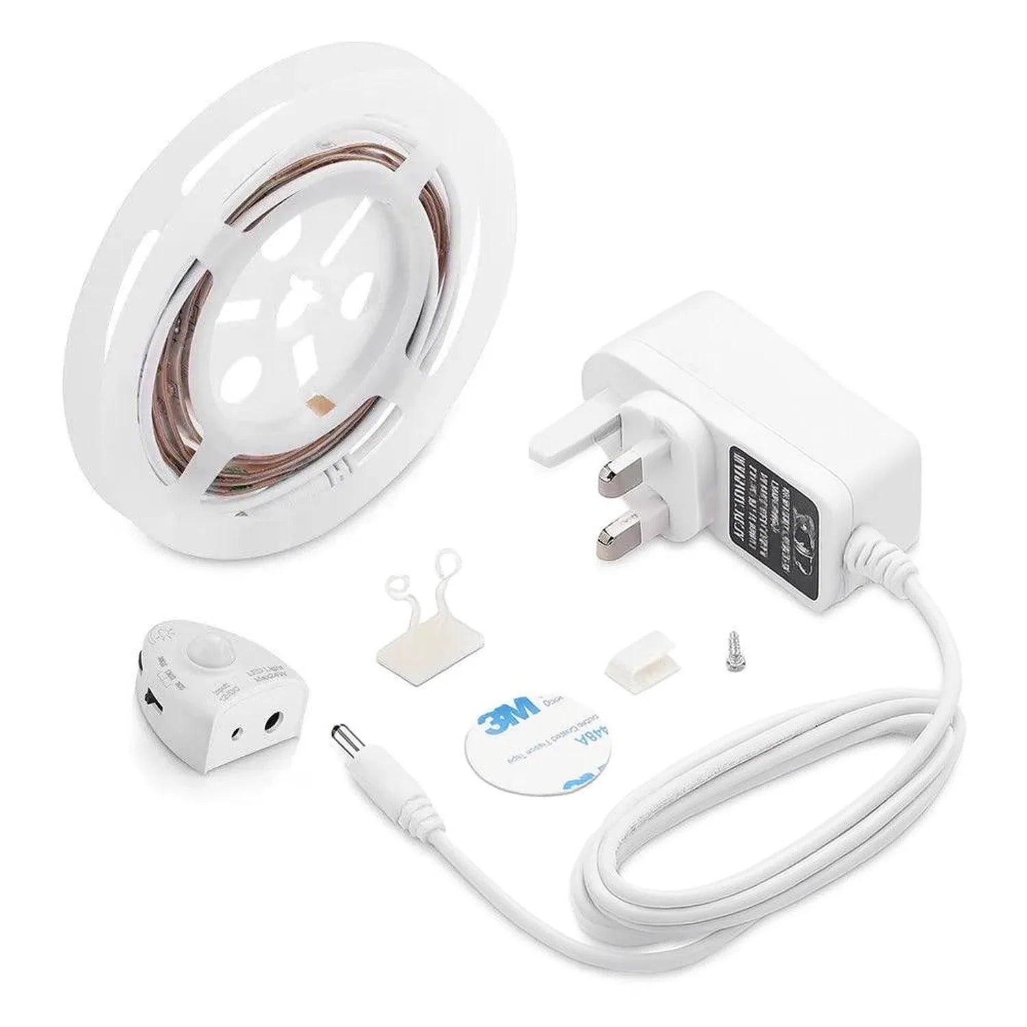 LED strip light kit components laid out including coiled strip with warm white lights, power adapter, motion sensor, connecto