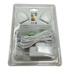 Packaged LED motion sensor light kit showing two white sensor heads, coiled white cord, power adapter, and energy rating labe