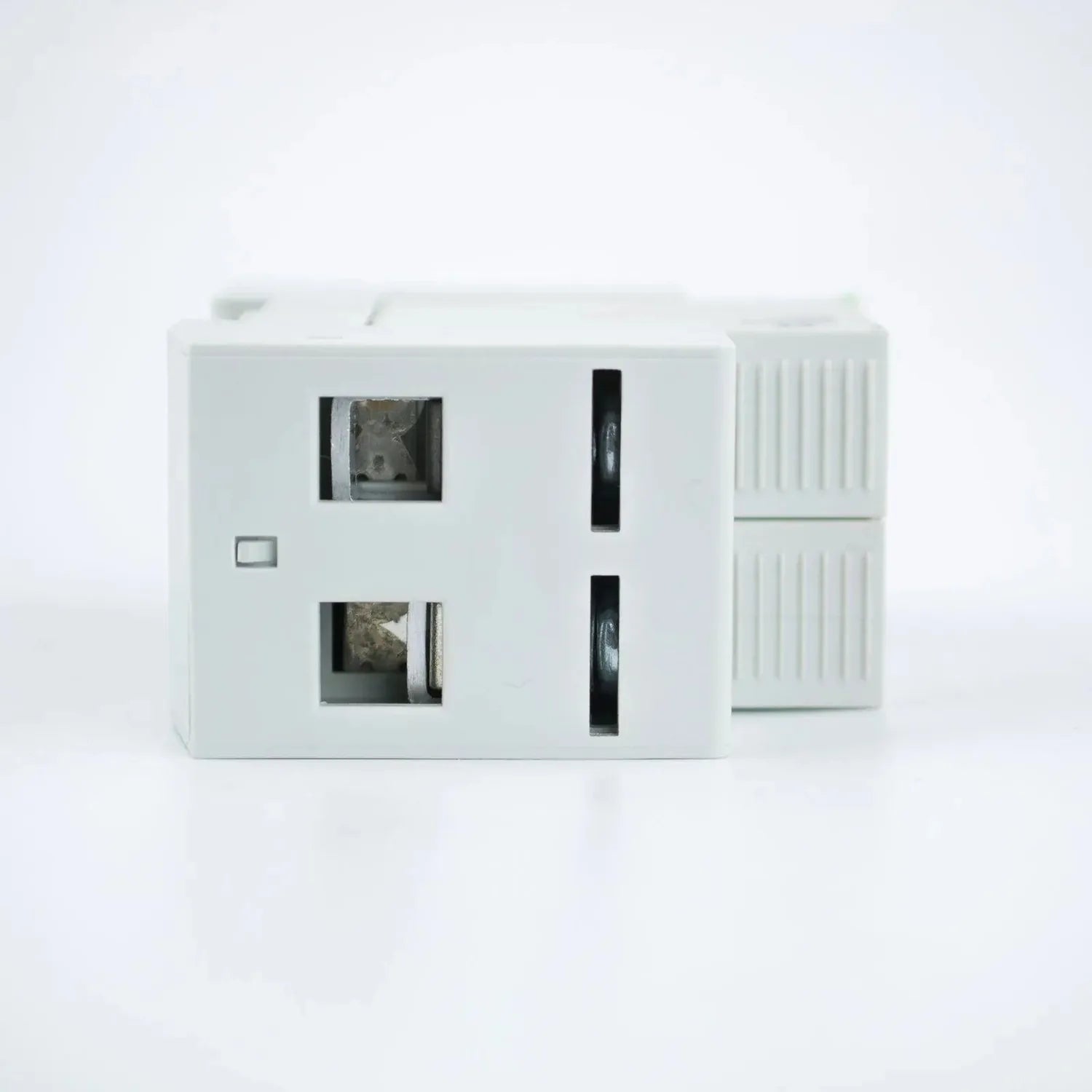 White surge protector device with two display windows and black ventilation slots on right side, shown against plain backgrou