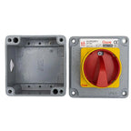 Front and back views of a Gawé 25A fire-rated switch disconnector with red handle and yellow surround on gray metal housing.
