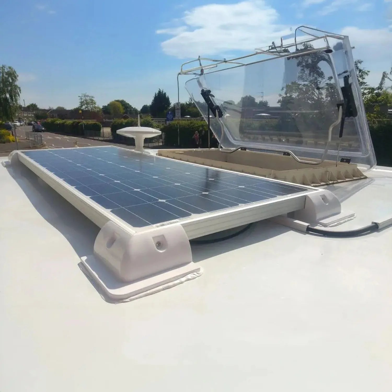 Solar panel mounting bracket kit installed on white RV roof with integrated cable management, shown in outdoor installation s