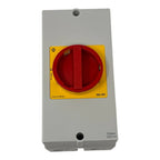 Kraus & Naimer rotary disconnect switch with red handle on yellow and gray enclosure, IP66/IP67 rated.