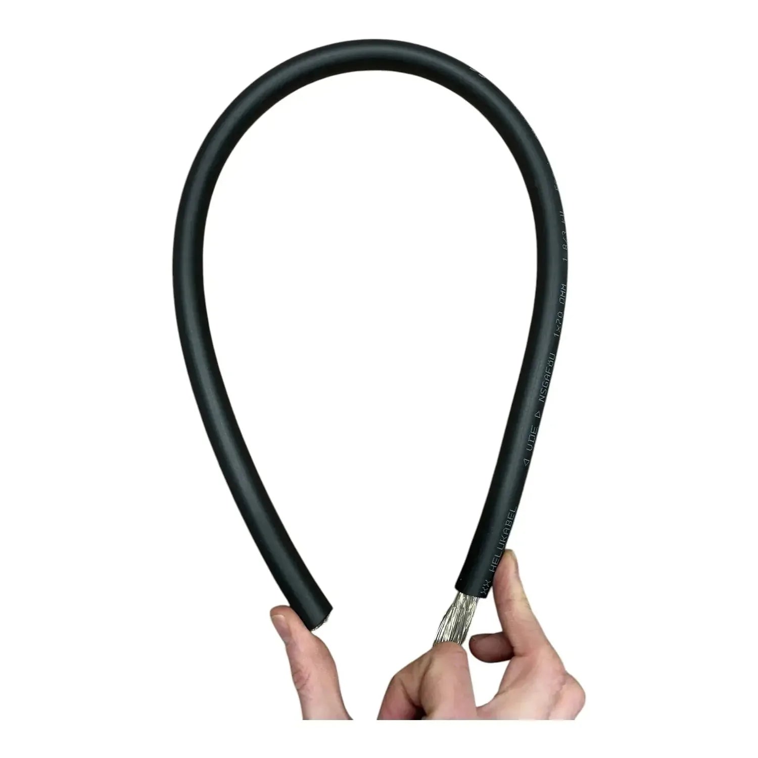 Black flexible battery cable with crimped connectors held in hands against white background.