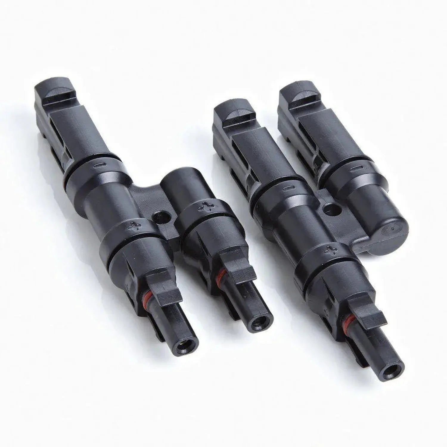 Three black solar MC4 connectors arranged in a row showing male and female paired connectors with red accent details.