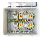 Open view of solar combiner box showing four input circuits with white disconnect switches and four output circuits with yell