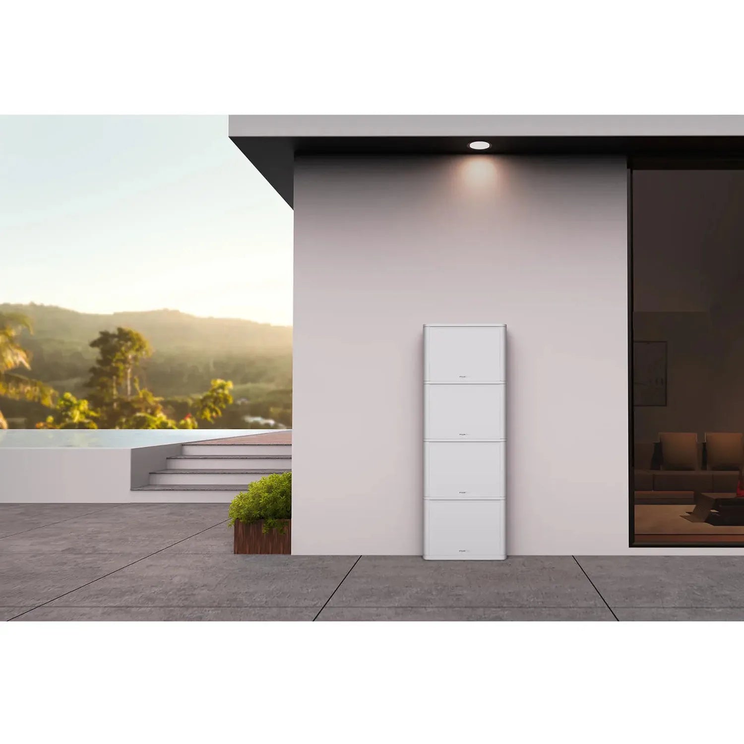 White stacked battery unit mounted on pink wall of modern home exterior overlooking landscape.
