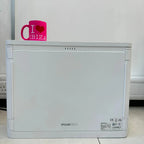 White Pylontech Pelio-L battery unit with pink "I love Ibiza" mug on top, showing rear panel with CE and RoHS certification l