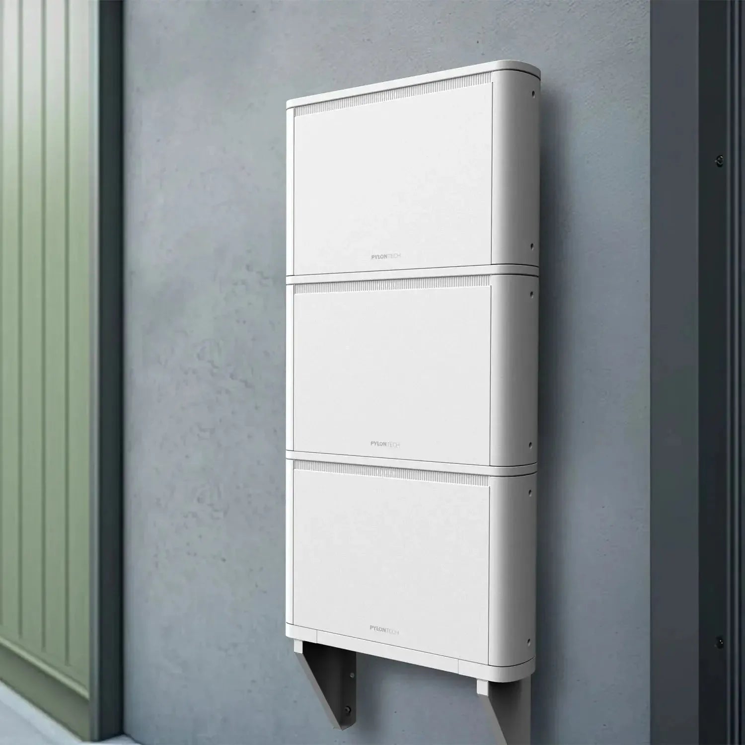 White stackable battery storage units mounted vertically on gray wall with metal mounting brackets, installation shot.