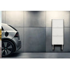 Pylontech Pelio wall-mounted battery system installed in modern garage next to electric vehicle charging.