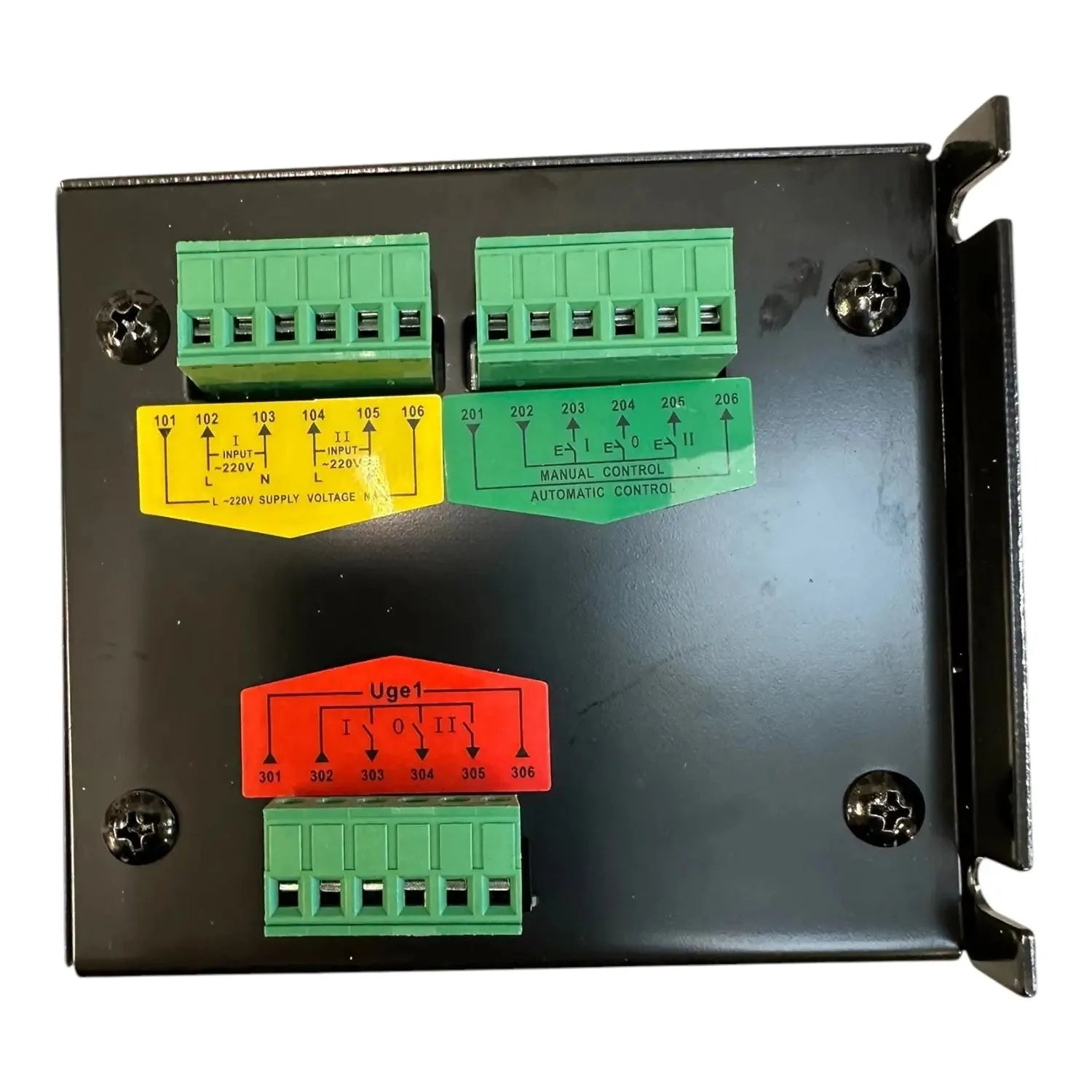 Black metal control panel with green terminal blocks, yellow input label, and red Uge1 selector switch showing manual and aut