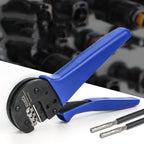 Blue-handled MC4 crimping tool with black metal head positioned next to two crimped solar connector terminals on white surfac