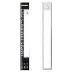 Ledison under cabinet light packaging and product display showing black box with white light fixture and motion sensor button