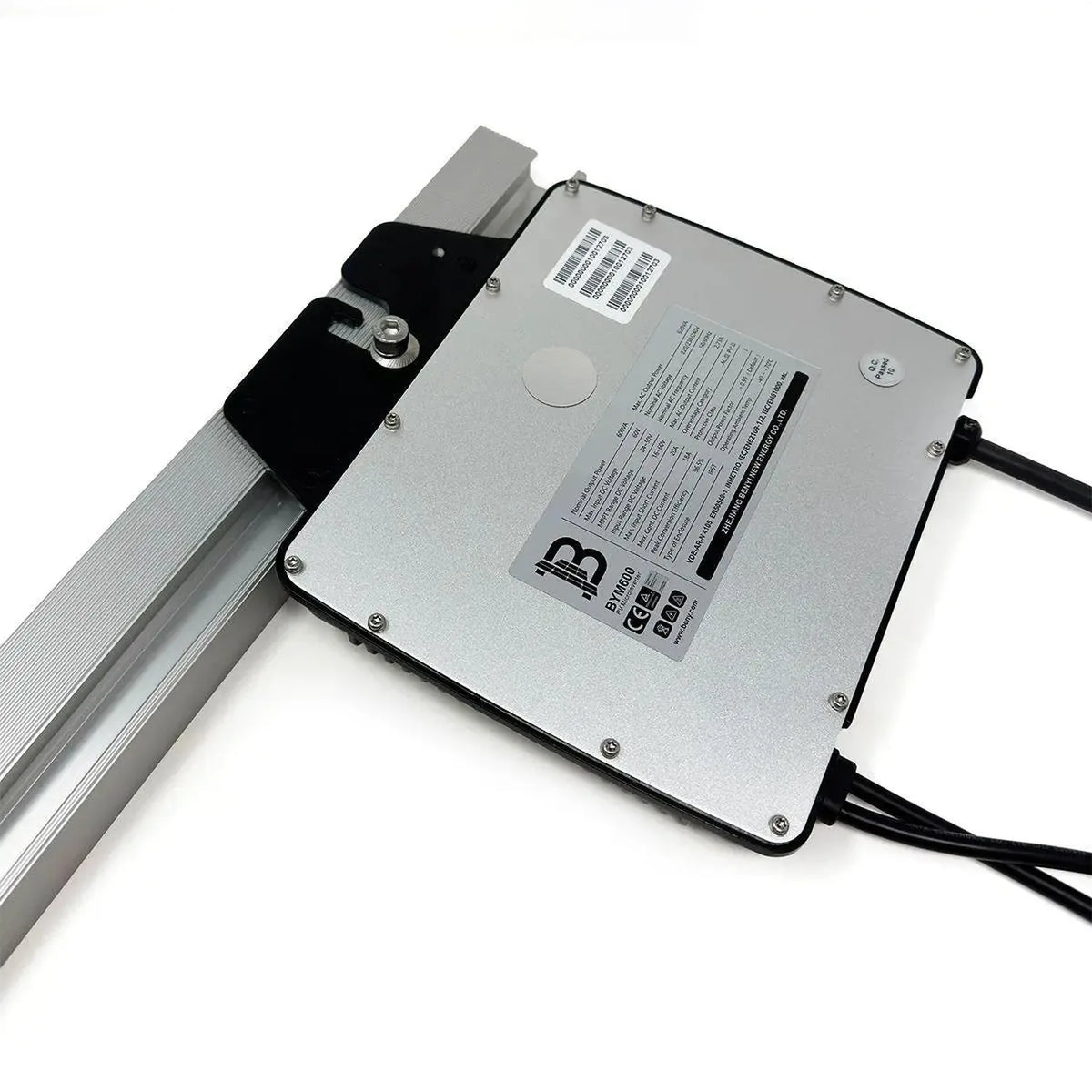 Silver inverter box mounted on aluminum rail with black connector and power cables, regulatory labels visible on back panel.