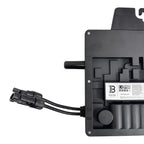 Black microinverter device with cable connector and specifications label, rear view showing internal components and mounting 