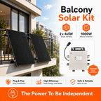 Two black solar panels mounted on a modern apartment balcony railing with city buildings in background, showing 1000W micro i
