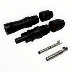 MC4-Evo 2 solar connector pair with two black housing connectors and two silver contact pins displayed on white background.