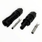 MC4-Evo 2 solar connector pair disassembled, showing two black housing shells, two metal pin contacts, and internal component