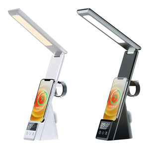 Two LED desk lamps with wireless phone chargers and digital clocks, shown in white and black versions with folding heads and 