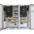 Open electrical cabinet showing dual Voltacon power conversion units with circuit breakers, wiring, and distribution componen