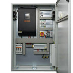 Voltagon power conversion cabinet interior showing black inverter unit, circuit breakers, wiring terminals, and safety discon