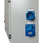 Wall-mounted cabinet showing AC generator/grid inlet and AC output/loads connectors with blue industrial sockets and terminal