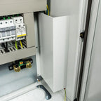 White cabinet installation shot showing circuit breakers, wiring, and internal components mounted in electrical enclosure.