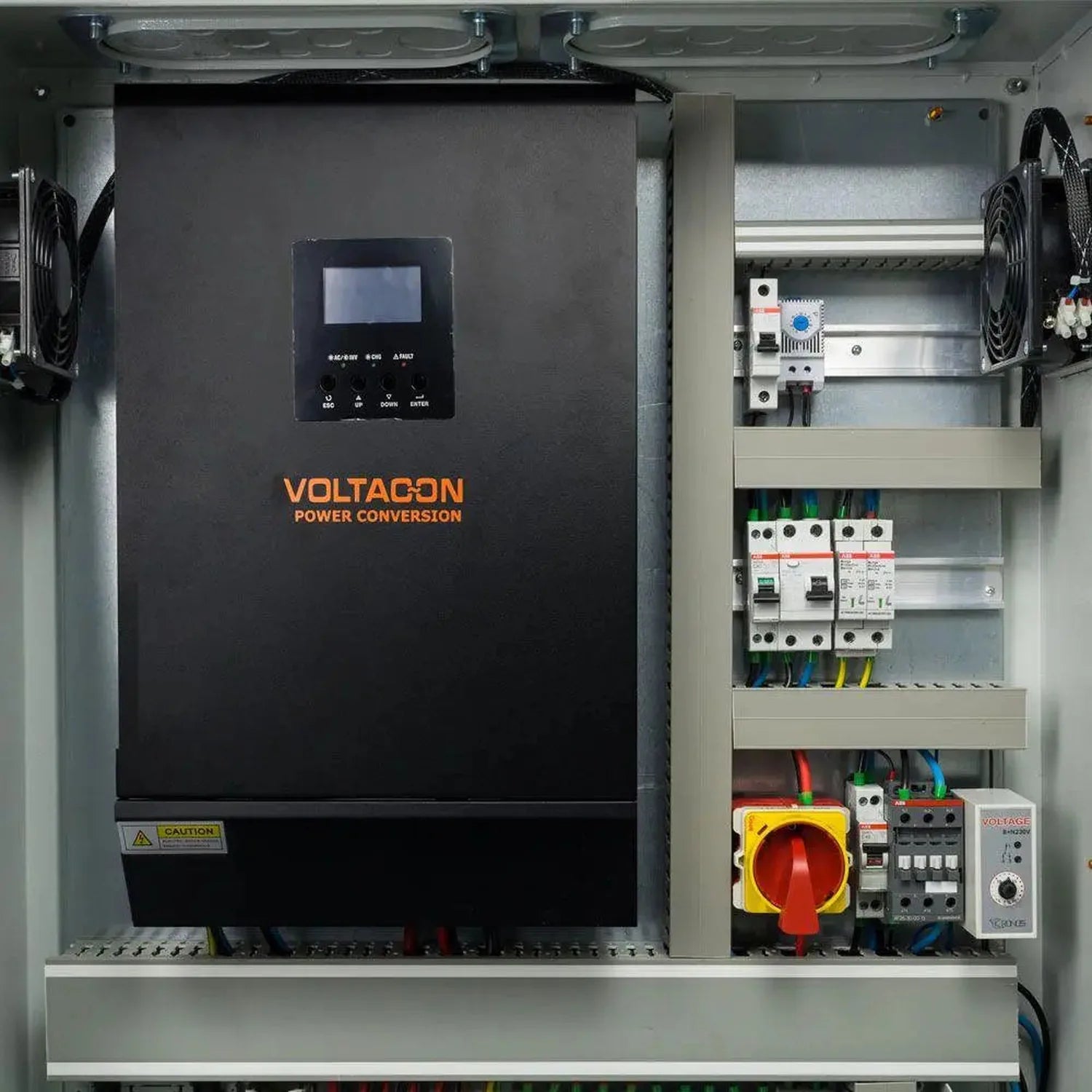 Voltacon 5kW power conversion inverter installed in electrical cabinet with circuit breakers, disconnects, and safety compone