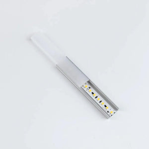 Aluminium LED profile U channel with integrated white diffuser cover and yellow LED chips mounted on white PCB, shown at angl
