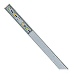 Angled view of a slim aluminum LED profile strip with five warm white LED modules mounted along its length, against a white b