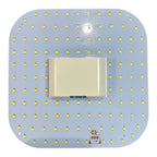 Top-down view of LED lamp module showing dense array of yellow SMD components on blue circuit board with central connector.