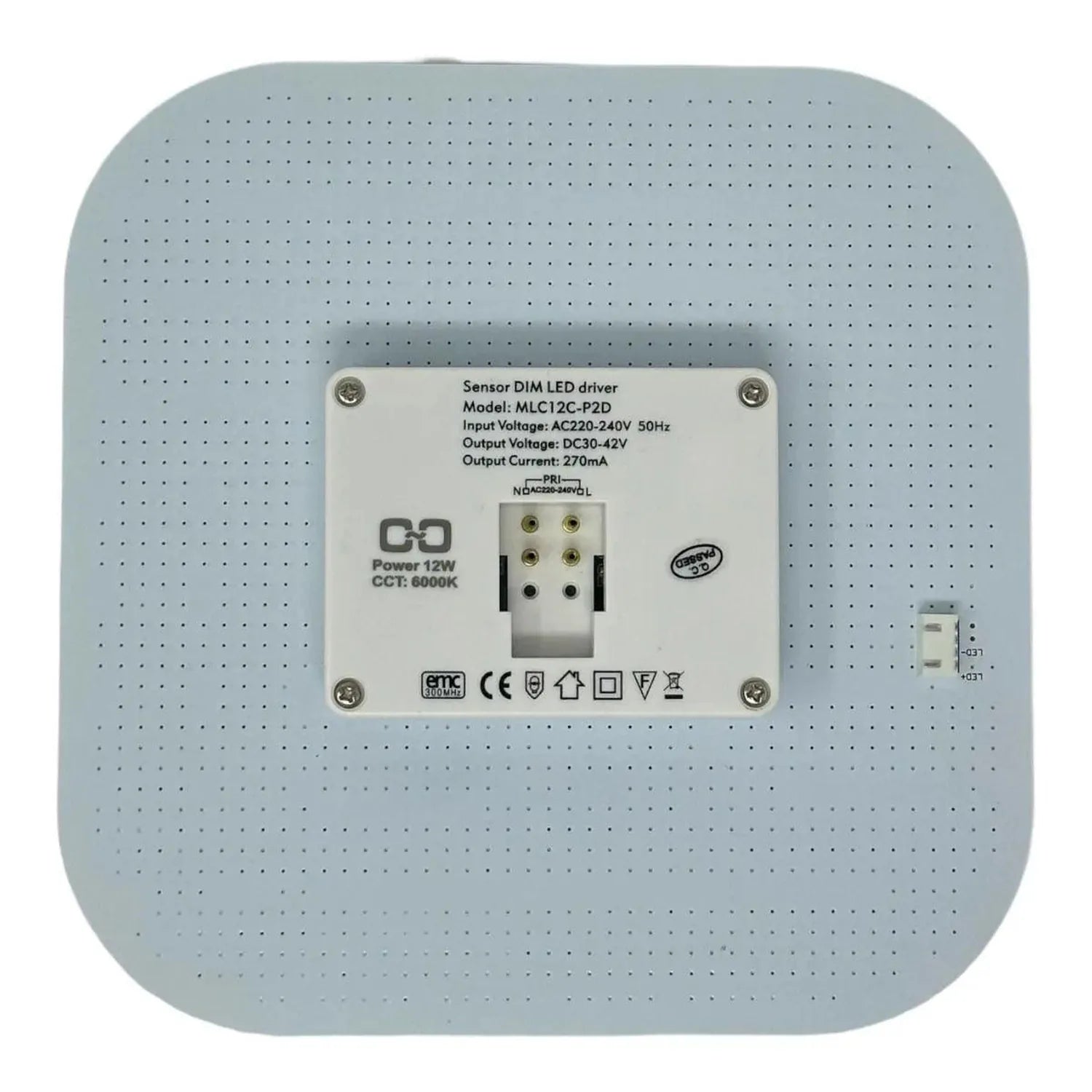 Back view of sensor-controlled 2D LED lamp showing terminal block connections and specifications label, mounted on perforated
