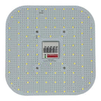 Overhead view of square LED panel with yellow LED chips arranged in grid pattern, central control module with display screen 