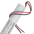 Yuasa 3.6V emergency lighting battery with red and black wire leads attached, product label visible on cylindrical white casi