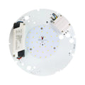 Circular LED module viewed from reverse side showing yellow SMD LEDs, white driver unit, wiring, and mounting holes.