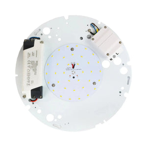 Circular LED module viewed from reverse side showing yellow SMD LEDs, white driver unit, wiring, and mounting holes.