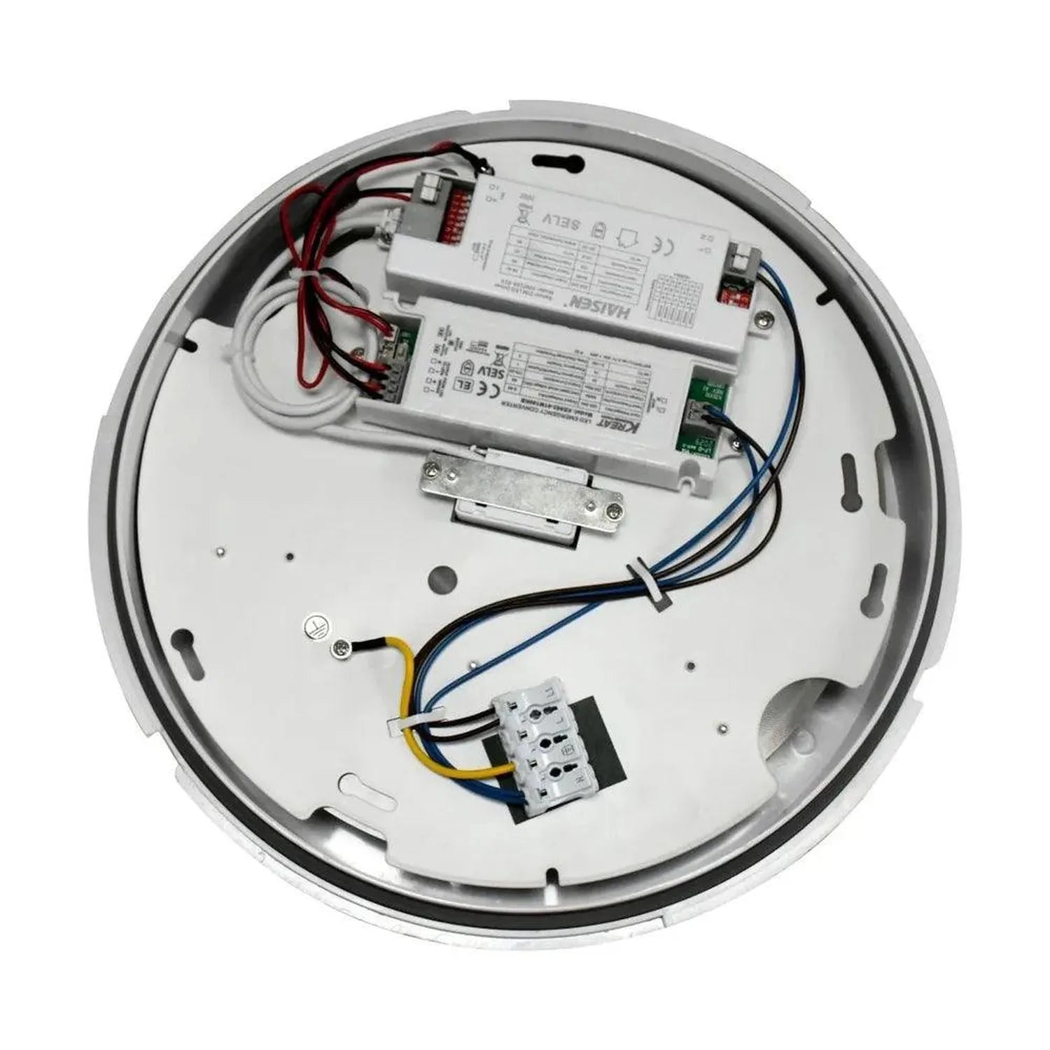 Interior view of LED retrofit fitting showing driver modules, wiring, and terminal connections mounted on white circular base