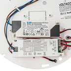 Internal components of LED retrofit fitting showing constant current driver, emergency converter, wiring, and circuit board c