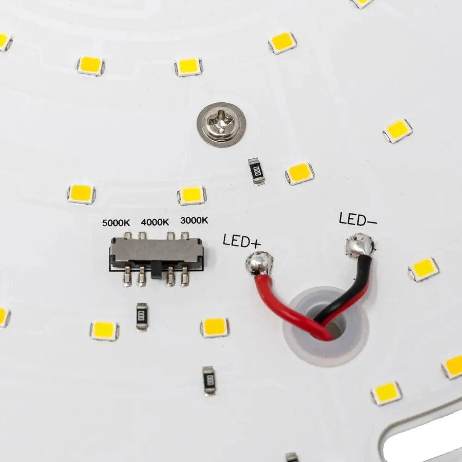 LED gear tray components laid out on white surface showing yellow SMD LEDs, multi-pin driver IC, resistors, and red and black