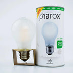 Pharox LED filament bulb next to its packaging, showing frosted glass globe with E27 base and 360 lumen specification.