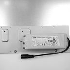EcKE constant current LED driver mounted on white panel with mounting hardware and black power cable visible.