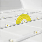 Yellow and white LED backlit panel light with angular degree markings displayed on gray mounting surface with alignment indic
