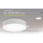 GL-DL06-SM Series LED surface mounted down light shown installed on ceiling, displaying round white panel with gray trim ring