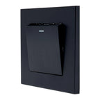 Black 1-gang 2-way light switch mounted on dark wall plate, showing small indicator light above toggle switch.