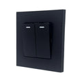 Black 2-gang 2-way light switch with illuminated indicator bars on each toggle, mounted on a dark square faceplate.