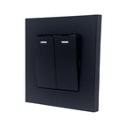 Black 2-gang 2-way light switch with illuminated indicator bars on each toggle, mounted on a dark square faceplate.