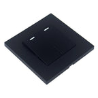 Black 2-gang 2-way light switch with dual toggle switches and indicator lights on square plate, isometric view.