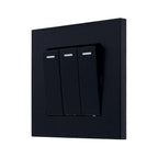 Black 3-gang 2-way light switch with white indicator bars on each toggle, mounted on square black faceplate.