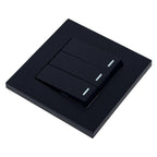 Black 3-gang 2-way light switch with illuminated toggle buttons on square faceplate, product shot on white background.