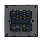 Rear view of electrical switch terminal block showing brass screw connections and wiring terminals on black housing.
